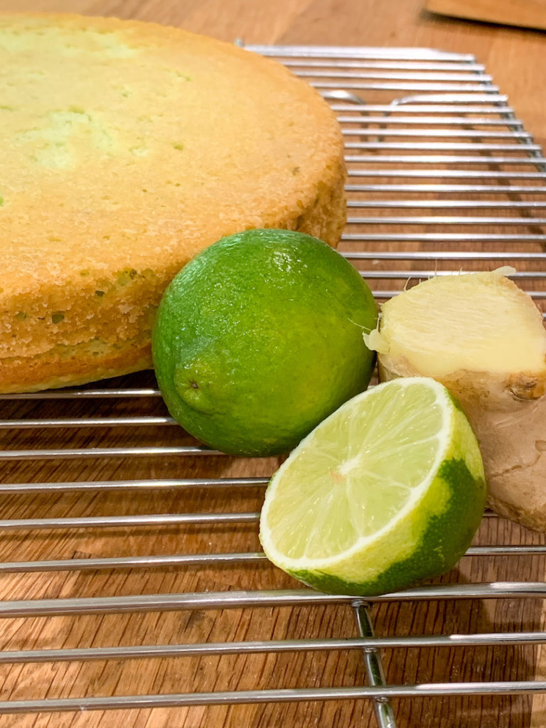 Lime and Ginger next to the cake as it cools on a wire rack