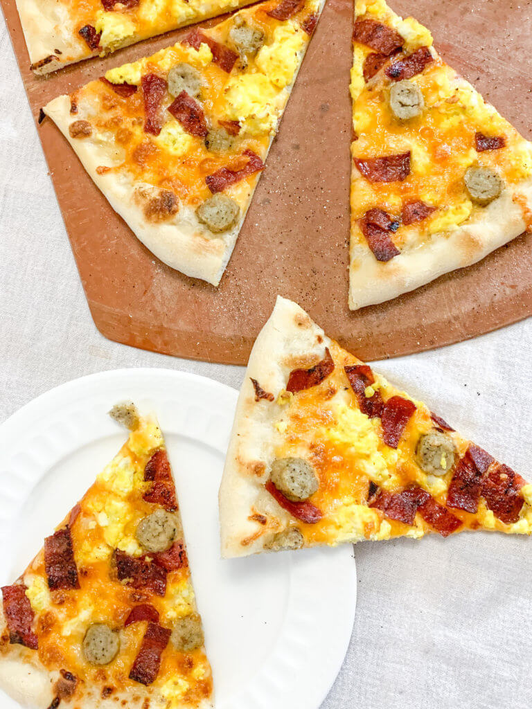 Ultimate breakfast pizza slices with turkey bacon and chicken sausage