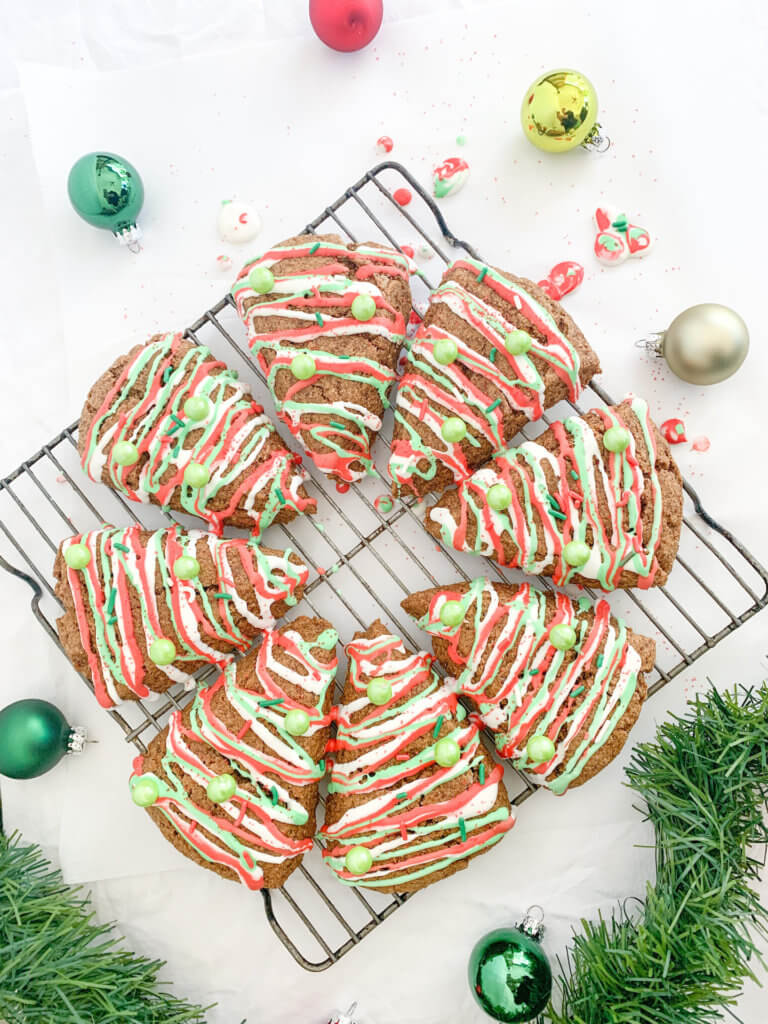 gingerbread scones drizzled with red, white, and green icing and sprinkles