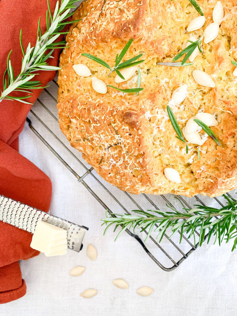 Overhead shot of pumpkin soda bread with asiago and rosemary
