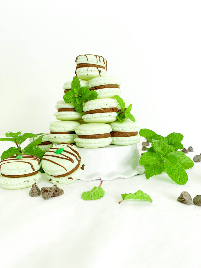Tower of mint chocolate macarons with mint and chocolate chips