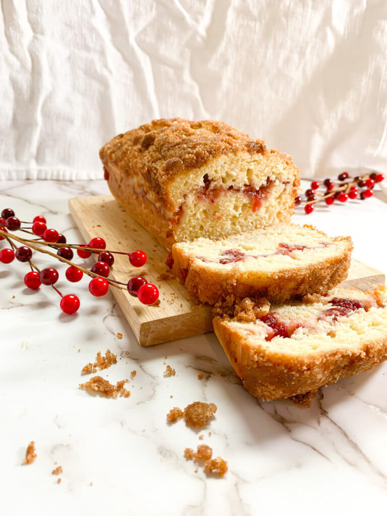 Cross-section of Cranberry Coffee Cake. Cake cut with two slices laying down.