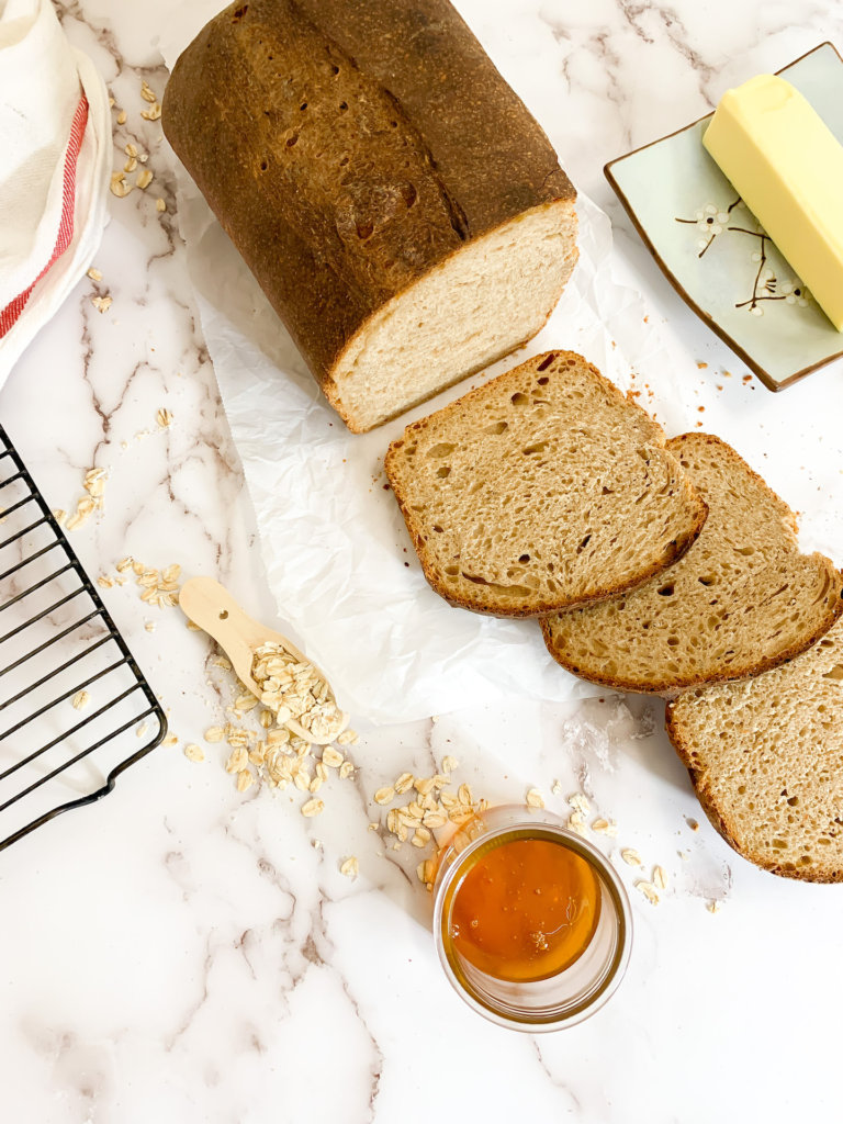 honey wheat sourdough sliced with butter and honey