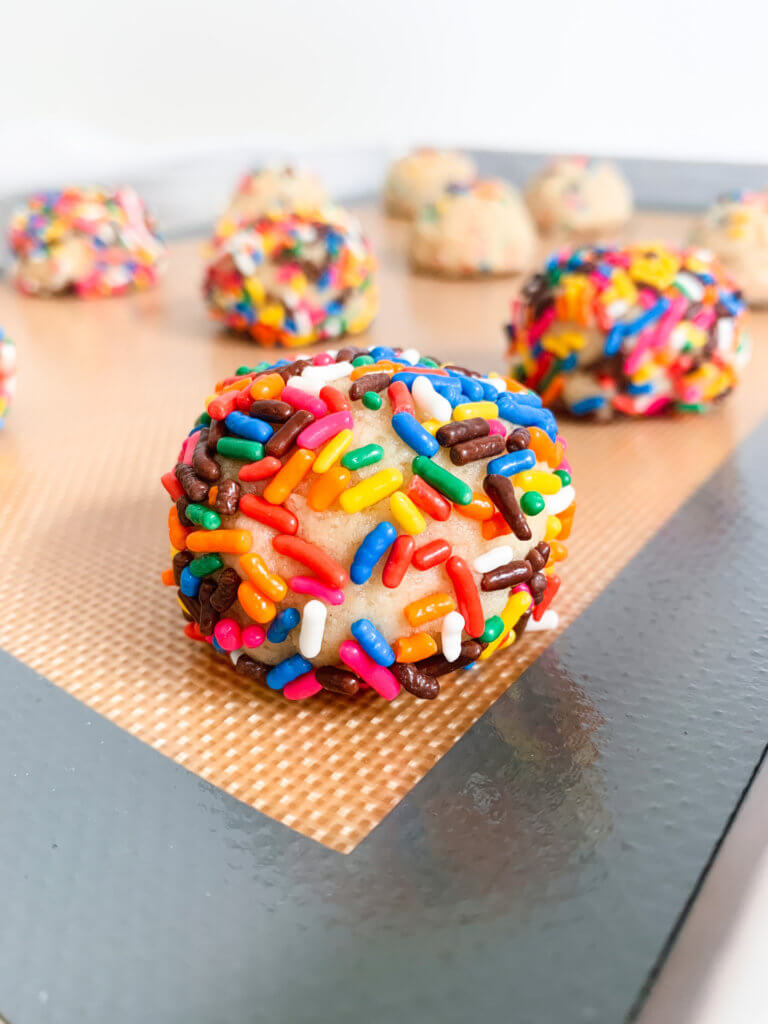 Closeup of a sprinkle covered cookie dough ball