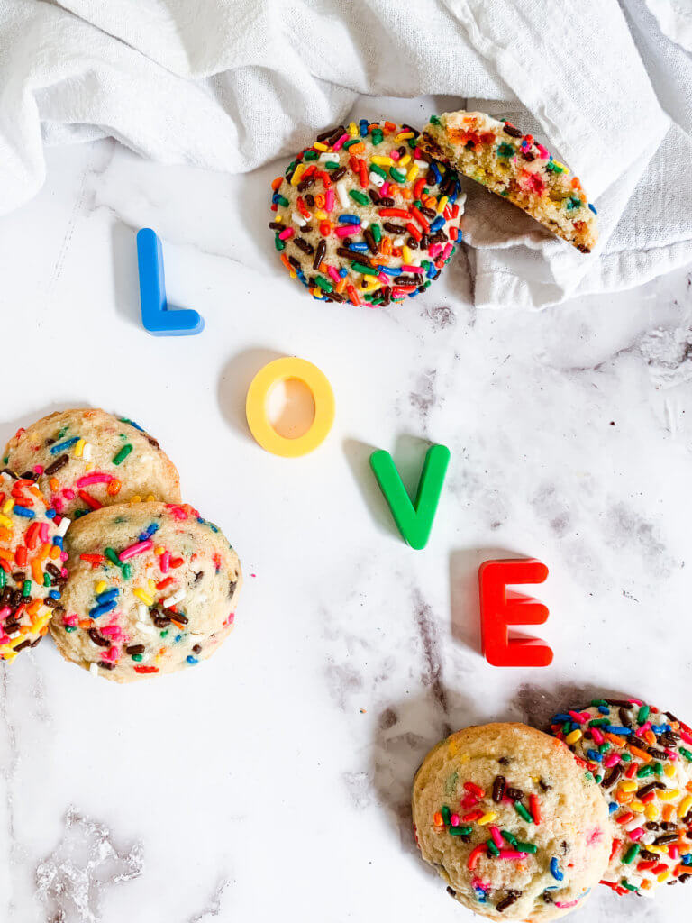 sprinkle cookies and magnet letters spelling LOVE