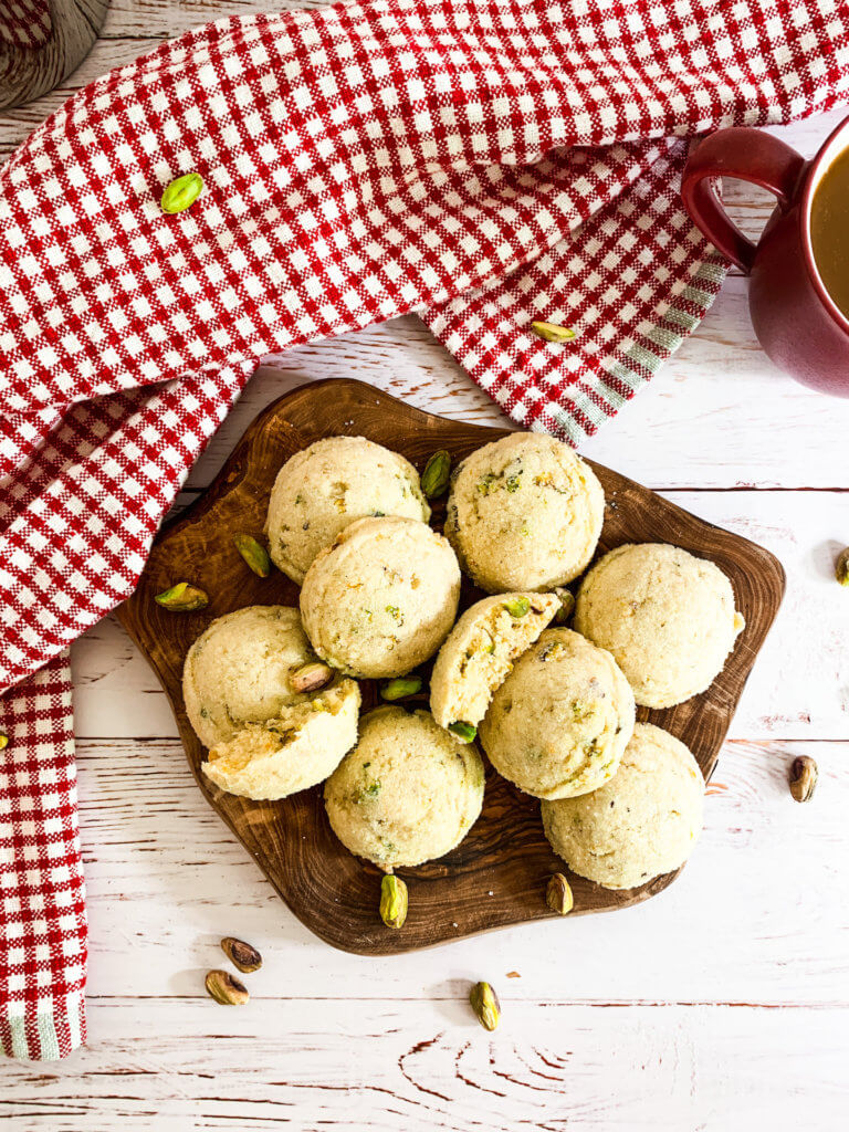 orange pistachio cookies with a red plaid towel
