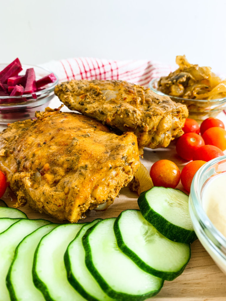 Chicken Shawarma with cucumbers on a dinner board